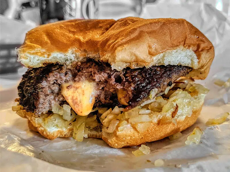 Jucy lucy burger with a bite