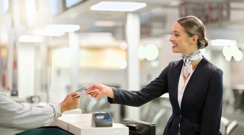 Happy concierge expert smiling for travel documents